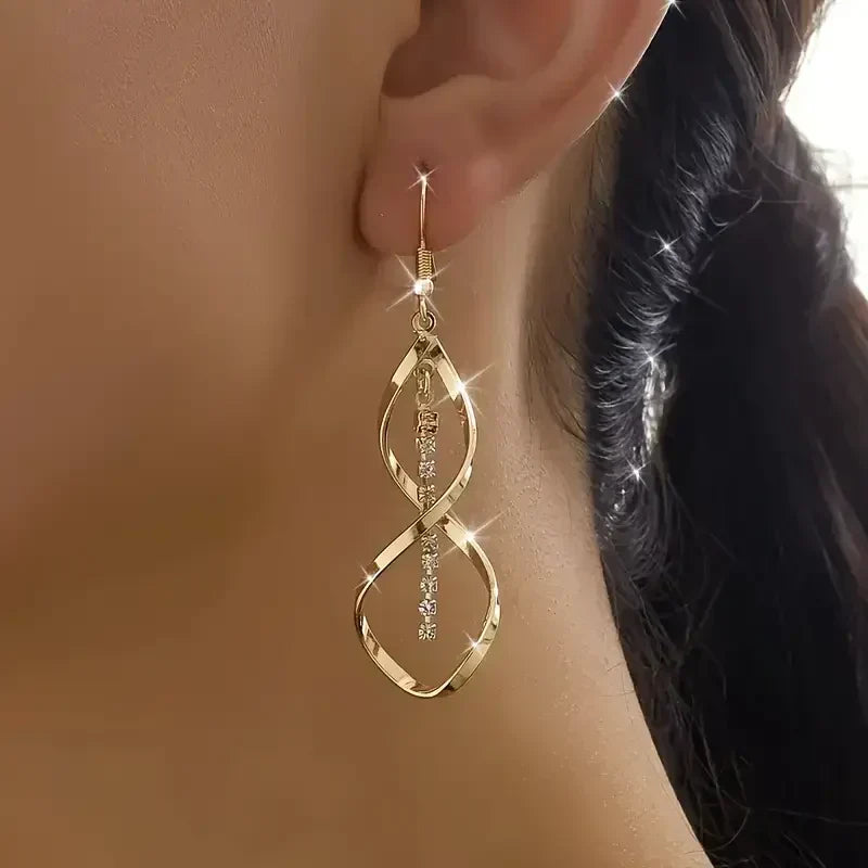 Pendientes en espiral «Rayo de sol» | Oro